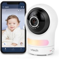White VTech RM9761 Smart Baby Cam with black lens, next to smartphone displaying baby monitor app.