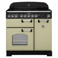 Classic 90cm induction range cooker in olive green with chrome trim, featuring a black control panel, multiple knobs, and a large oven window.