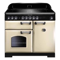 Classic Deluxe 100cm induction range cooker in olive green with chrome trim, featuring two ovens, a black glass hob, and multiple control knobs.