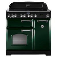 Classic 90cm induction range cooker in racing green with chrome trim, featuring six control knobs, a large oven window, and a sleek black backsplash.