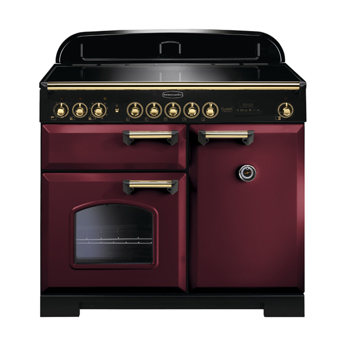Classic Deluxe 100cm induction range cooker in cranberry with brass trim, featuring a sleek black top, multiple control knobs, and two ovens with a glass window.