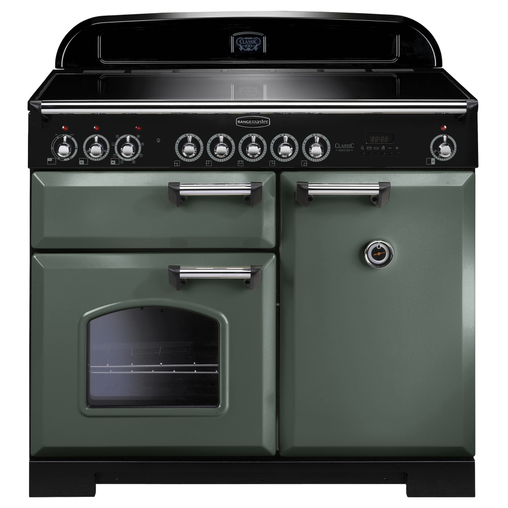 Classic Deluxe 100cm induction range cooker in mineral green with chrome trim, featuring multiple control knobs, two doors, and a large oven window.