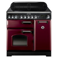 Classic 90cm induction range cooker in cranberry with chrome trim, featuring a sleek black glass top, multiple control knobs, and two ovens with a glass window.