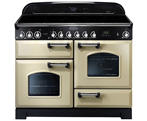 Classic 110cm induction range cooker in cream with chrome trim, featuring two ovens, a sleek black glass top, and multiple control knobs for precise cooking.