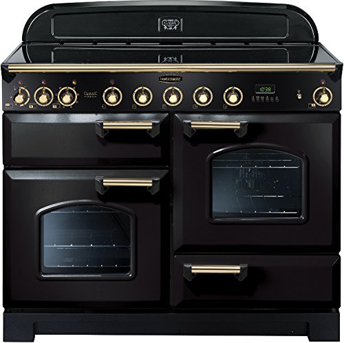 Classic Deluxe 110cm induction range cooker in black with brass trim, featuring four hobs, two ovens, and a digital display with control knobs.