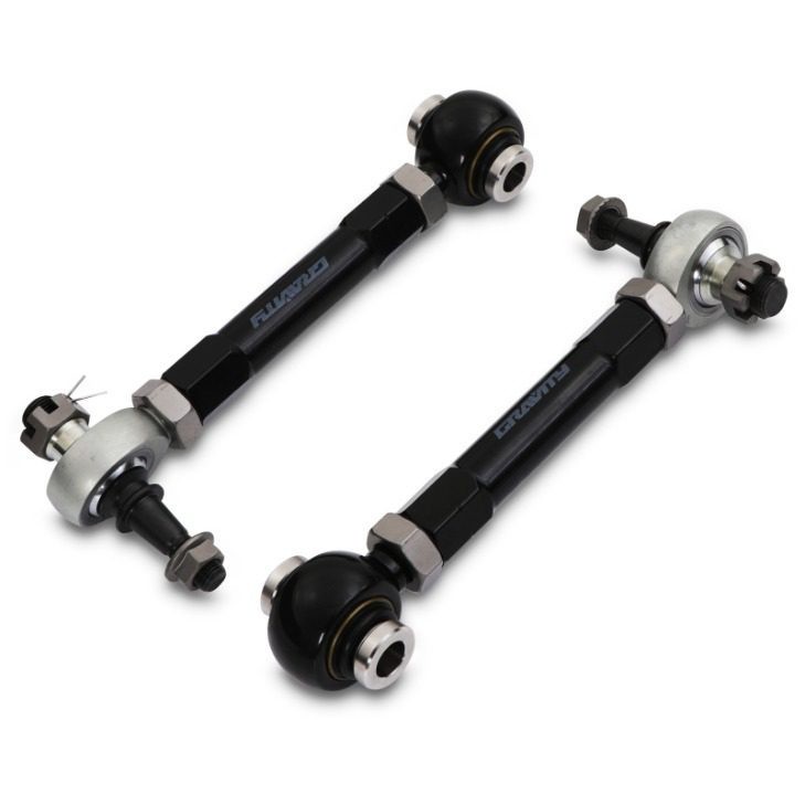 Adjustable rear toe arms for Toyota Supra MK4 JZA80, featuring a sleek black finish, durable metal construction, and spherical bearings for enhanced performance.
