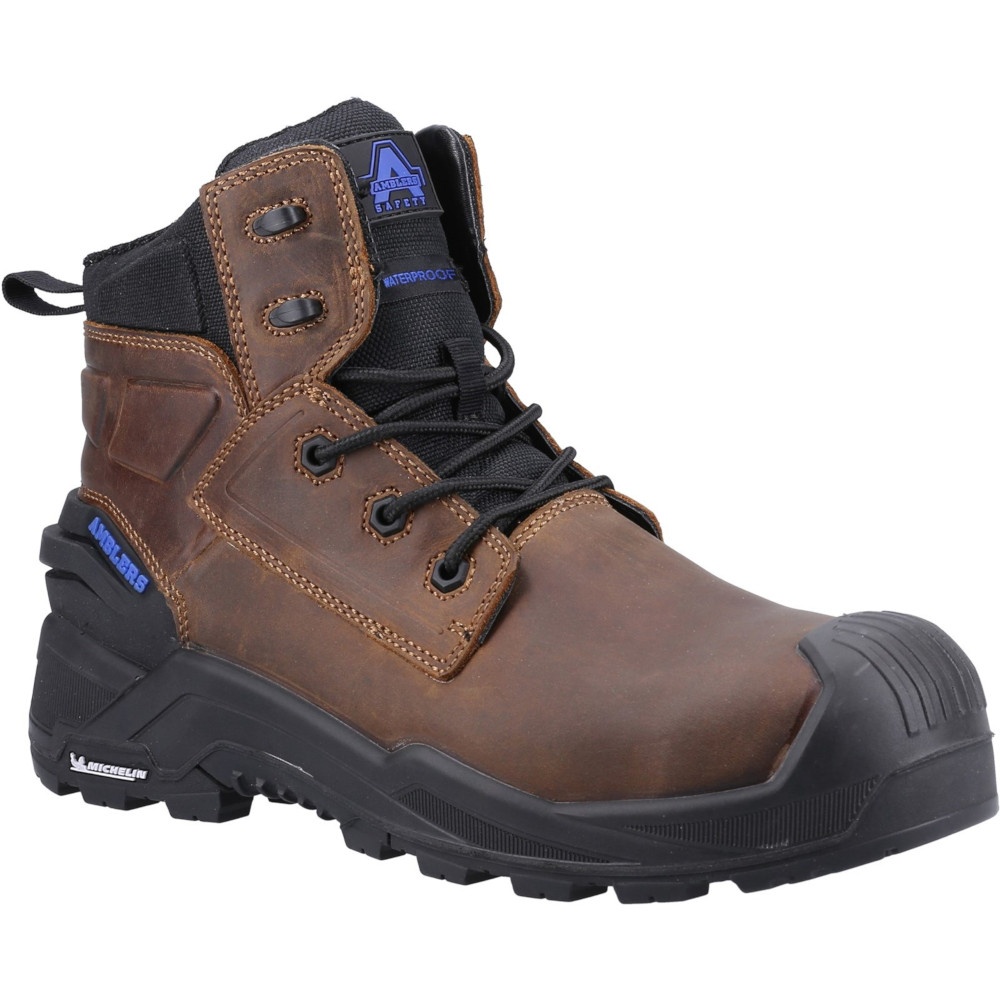 Brown leather safety boot with a black padded collar, lace-up front, reinforced toe cap, and rugged rubber sole, featuring Amblers Safety branding and waterproof design.