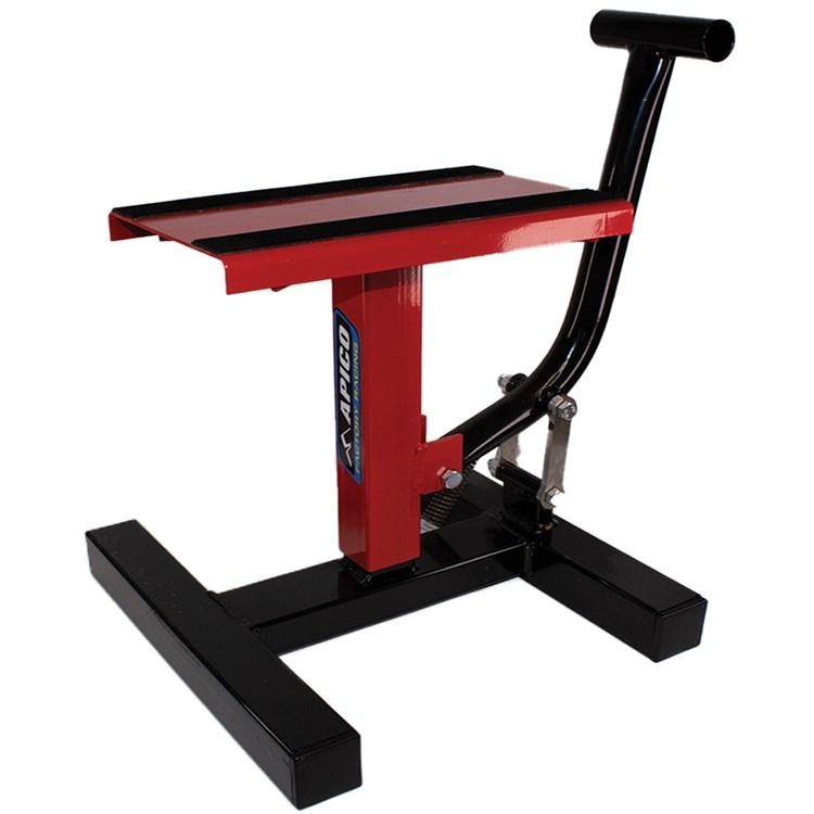 Red Apico Factory Lift Paddock Stand with a sturdy black base, featuring a flat top surface and a handle for easy maneuvering, designed for lifting motorcycles.