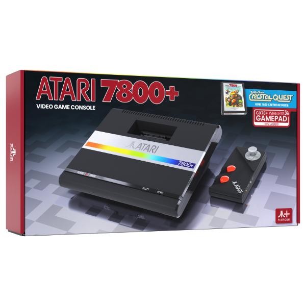 Black Atari 7800+ video game console with a rainbow stripe, accompanied by a gamepad and a game box featuring "Crystal Quest," all presented in a colorful retail box.