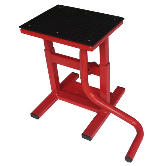 Red adjustable MX jack workshop stand with a black textured top, sturdy metal frame, and a curved support arm, designed for bike maintenance.
