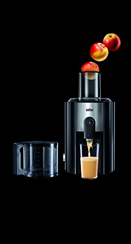 Braun Spin Juicer in sleek black with a 900W motor, featuring a transparent juice container and whole apples being juiced, showcasing its powerful extraction capabilities.