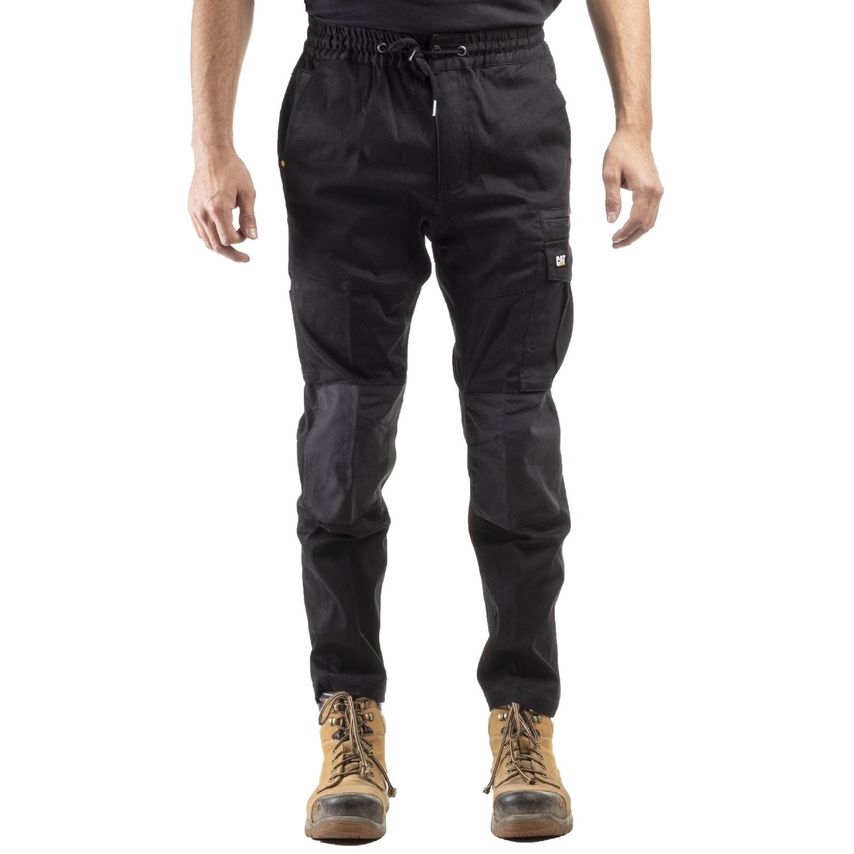 Black Caterpillar men's dynamic trousers featuring an elastic waistband, multiple pockets, and reinforced knee panels, made from durable material, paired with tan work boots.