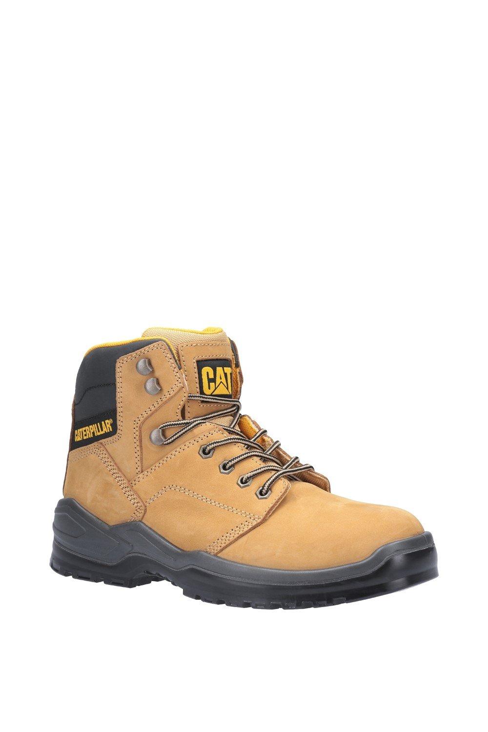 Honey-colored leather safety boot with a steel toe cap, black padded collar, and yellow laces; features a rugged sole and Caterpillar branding on the tongue and side.