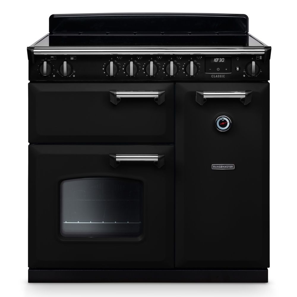 Classic 90cm induction cooker in black with chrome accents, featuring six control knobs, a large oven door with a window, and a sleek, modern design.