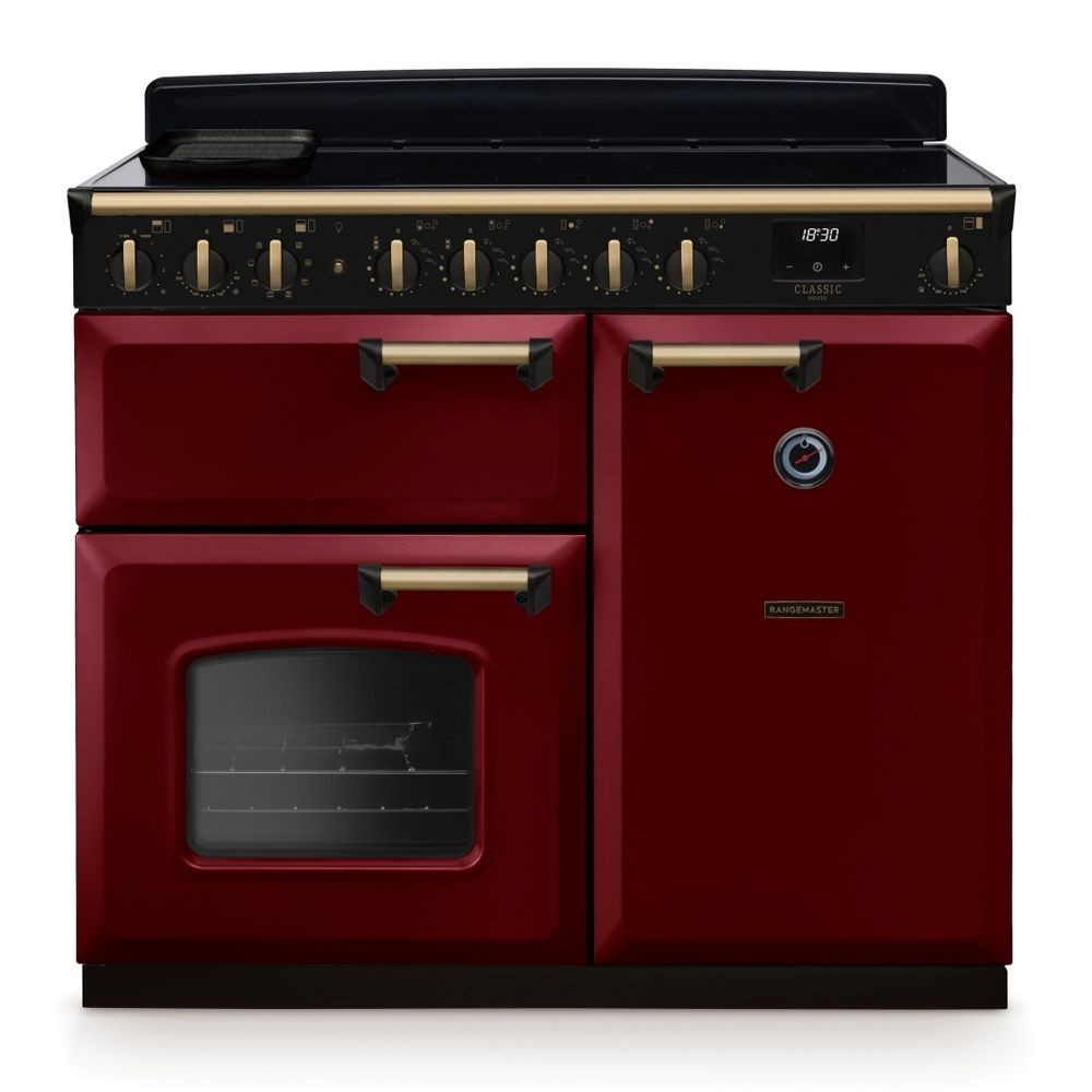 Classic Deluxe 100cm induction range cooker in Bordeaux red with antique brass knobs, featuring a sleek black hob and a large glass oven door.