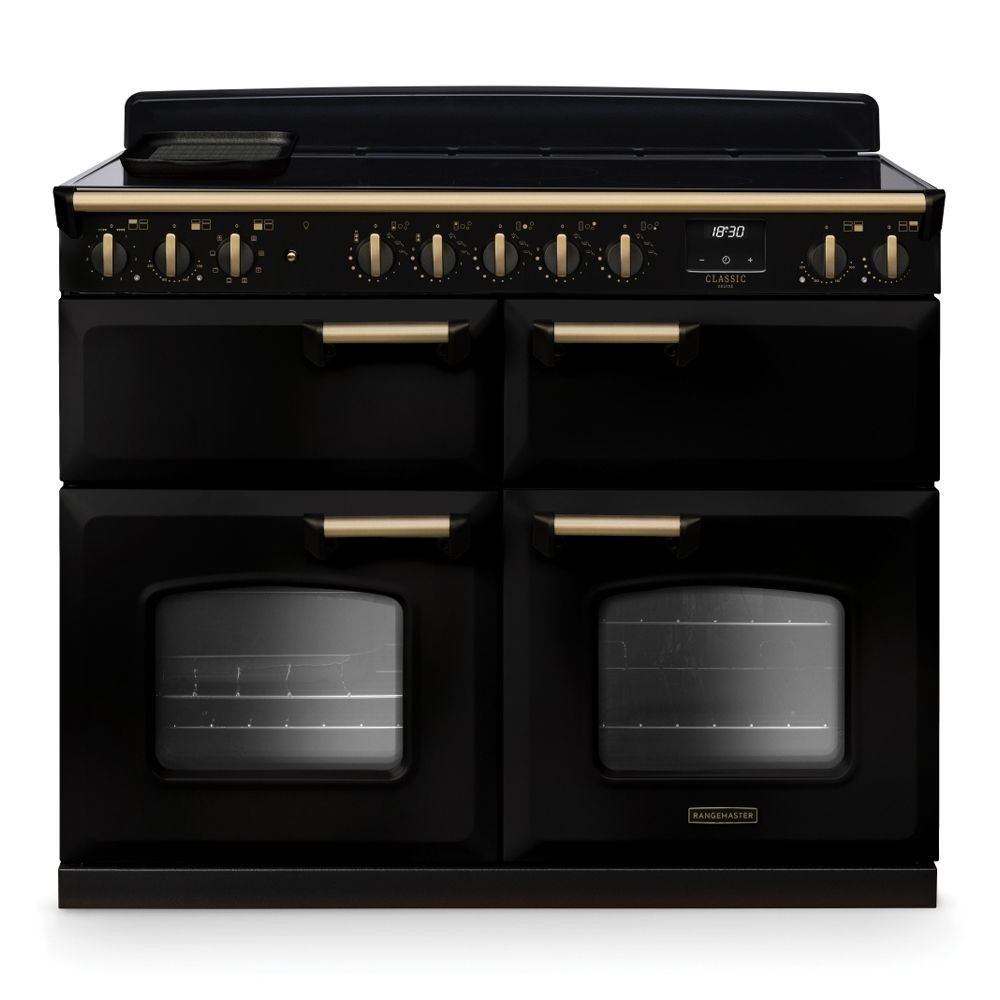 Classic Deluxe 110cm BC induction range cooker in black with antique brass accents, featuring four oven doors, multiple control knobs, and a sleek design.