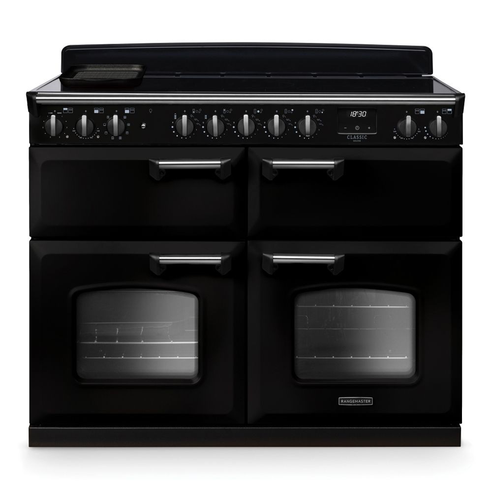 Classic Deluxe 110cm BC induction range cooker in black and chrome, featuring four hobs, dual ovens with glass doors, and chrome knobs for temperature control.