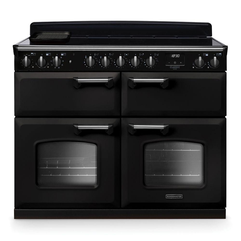 Classic Deluxe 110cm BC induction range cooker in charcoal black and chrome, featuring four ovens, a sleek control panel, and multiple knobs for precise cooking.