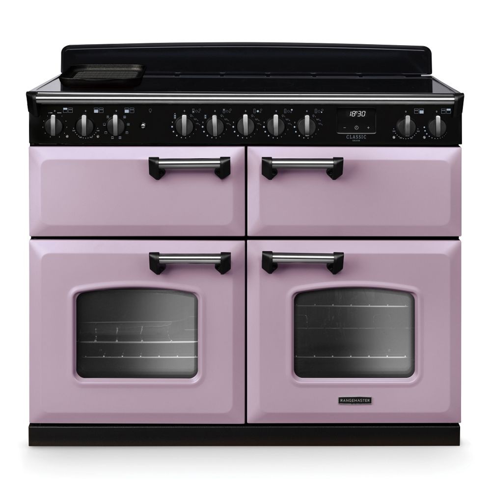 Classic Deluxe 110cm BC induction range cooker in heather and chrome, featuring four ovens, a sleek black control panel, and multiple knobs for precise cooking control.