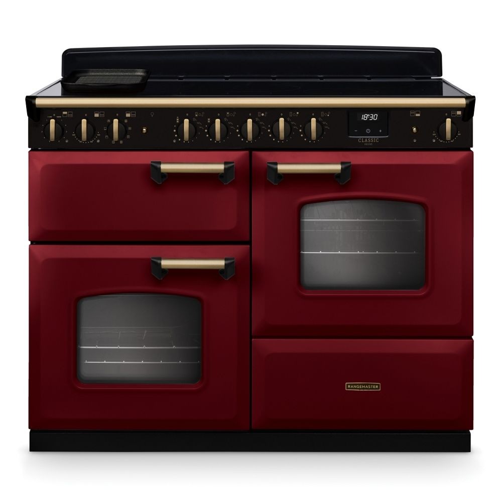 Classic Deluxe 110cm induction range cooker in Bordeaux red and antique brass, featuring two ovens, multiple control knobs, and a sleek black induction hob.