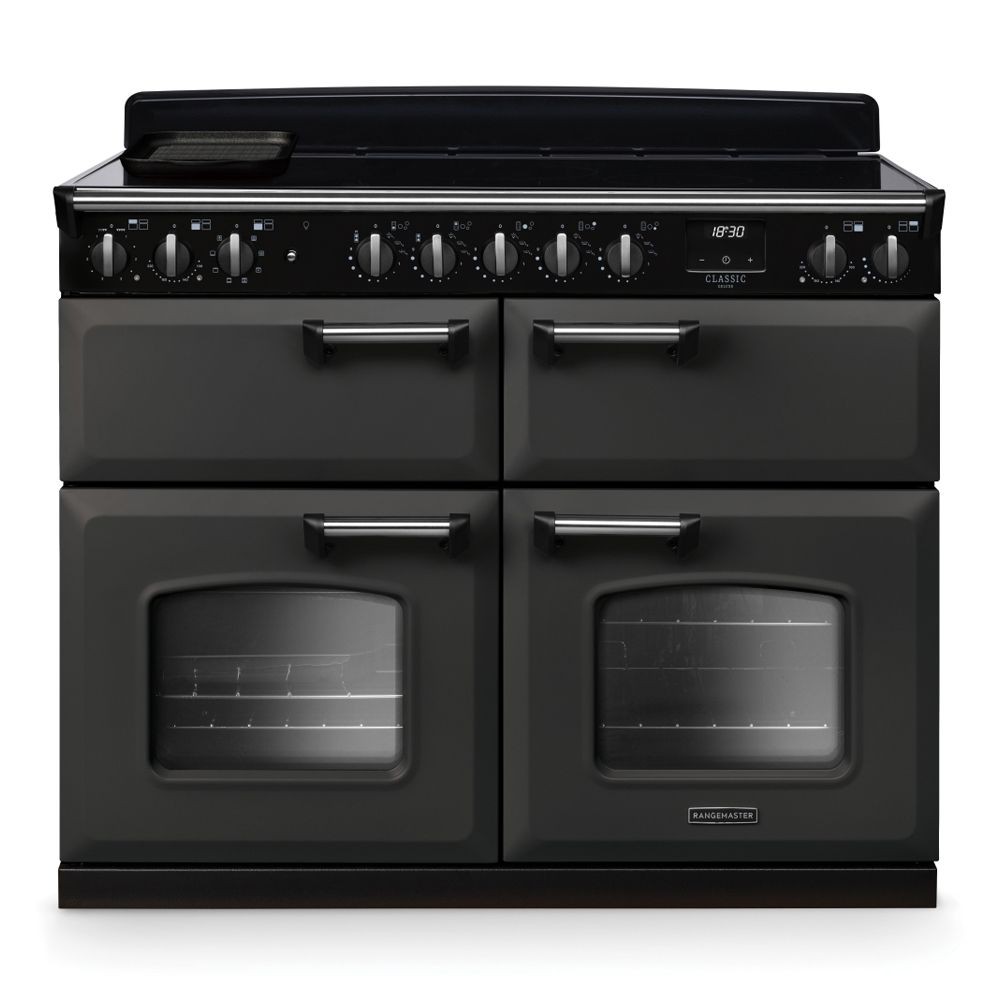 Classic Deluxe 11cm BC induction range cooker in slate and chrome, featuring four ovens, multiple control knobs, and a sleek black finish.
