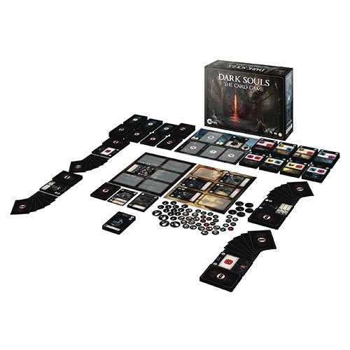 A tabletop card game set featuring a dark-themed box, various cards, tokens, and game boards arranged on a surface, all showcasing intricate designs and a gothic color palette.