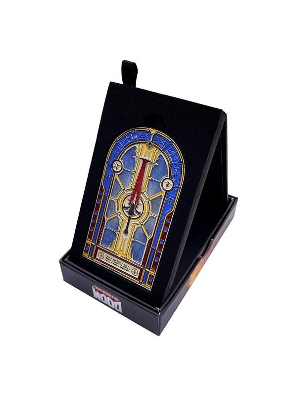 Limited edition stained glass window ingot featuring a colorful design with gold accents, set in a black display stand, showcasing intricate details from the Doom game.