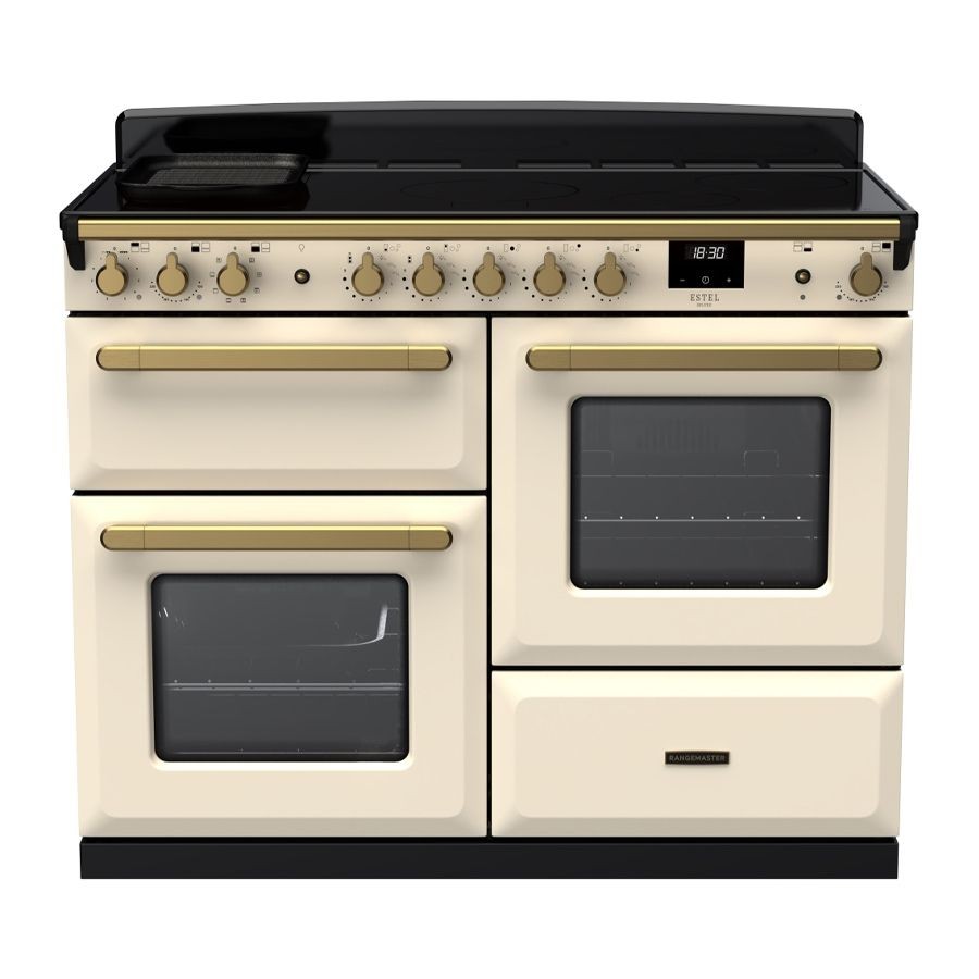 Pale cream induction range cooker with antique brass accents, featuring four knobs, two ovens with glass doors, and a sleek black cooktop.