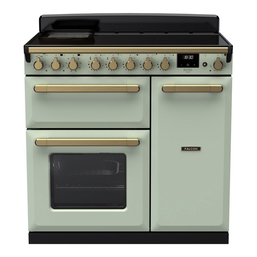 Mint green induction range cooker with antique brass knobs and handles, featuring a sleek black top, two ovens, and a digital display for precise temperature control.