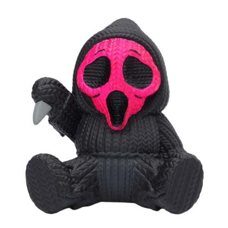 Collectible Ghost Face vinyl figure in black with a textured knit design, featuring a bright fluorescent pink mask and claw, waving with one hand.