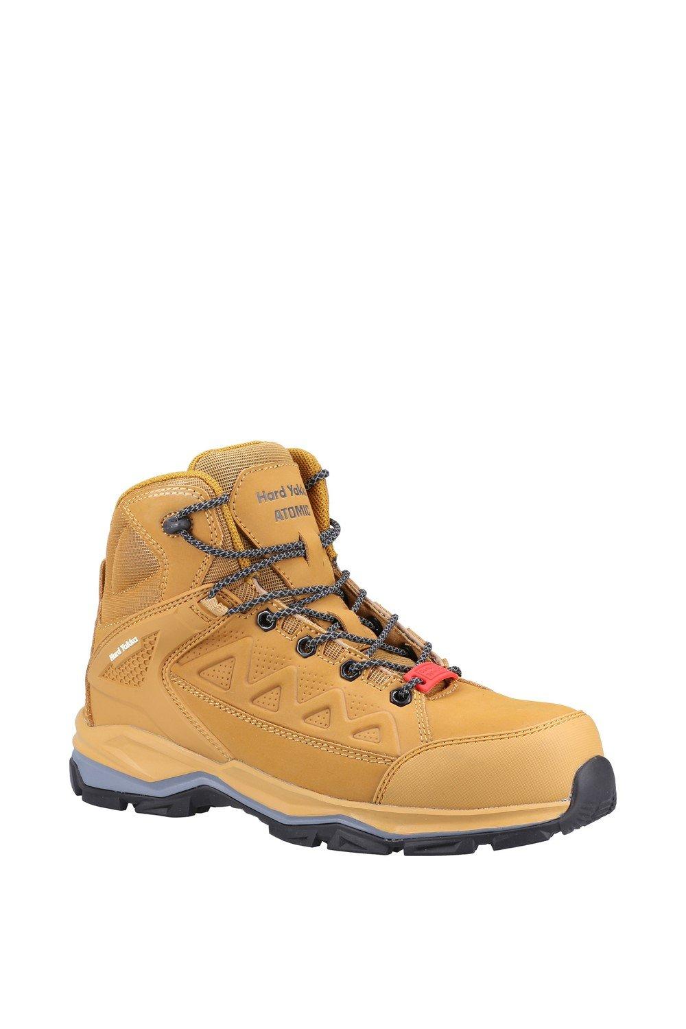 Hard Yakka unisex safety boot in wheat color features a side zip, durable leather material, textured design, and a sturdy rubber sole for enhanced grip and protection.