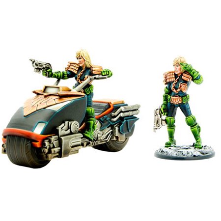 A detailed miniature of Judge Anderson, featuring a blonde figure in green and orange armor, standing next to a futuristic motorcycle with metallic accents.