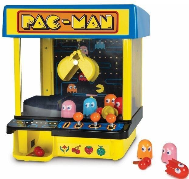 Brightly colored Pac-Man Claw Crane Game featuring a blue and yellow design, with a transparent front, claw mechanism, and colorful ghost figures in a playful arcade style.