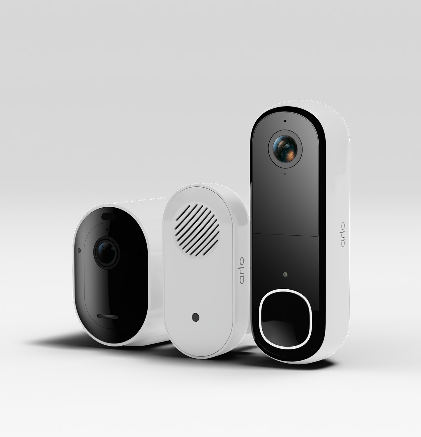Three sleek, white security devices by Arlo, including a camera, doorbell, and sensor, featuring modern designs with black accents and a prominent lens on each unit.