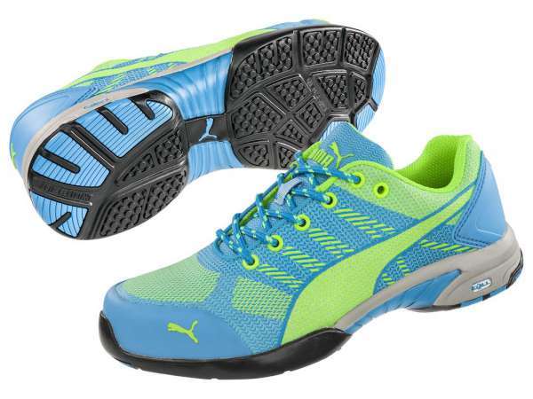 Lightweight blue and neon green Puma Safety women's trainers featuring a breathable knit upper, cushioned sole, and slip-resistant outsole.