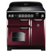 Classic 90cm induction cooker in cranberry with chrome trim, featuring a sleek black cooking surface, six control knobs, and dual oven doors with a window.