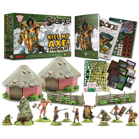 Slaine: Kiss My Axe! Starter Set includes two thatched-roof huts, miniatures of warriors and creatures, game cards, and tokens, all in vibrant colors and detailed designs.