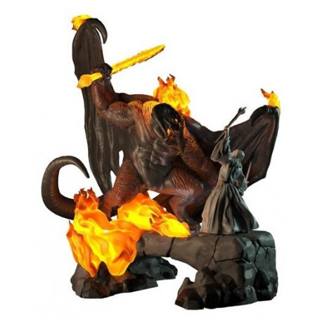 A detailed figurine depicting Gandalf in grey robes facing a fiery Balrog, with vibrant orange flames and a rocky base, showcasing intricate textures and colors.