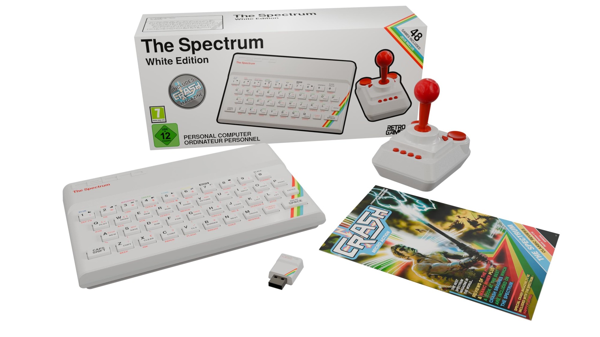 The Spectrum White Edition features a sleek white keyboard with colorful accents, a classic joystick, a USB connector, and a vibrant game booklet, all presented in a stylish box.
