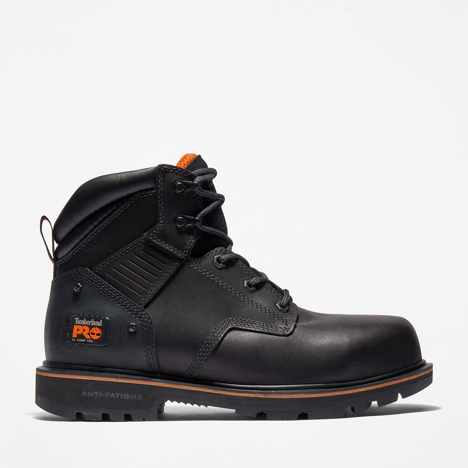 Black leather safety boots with composite toe cap, lace-up design, orange accents, and anti-fatigue technology, marked with Timberland Pro logo.