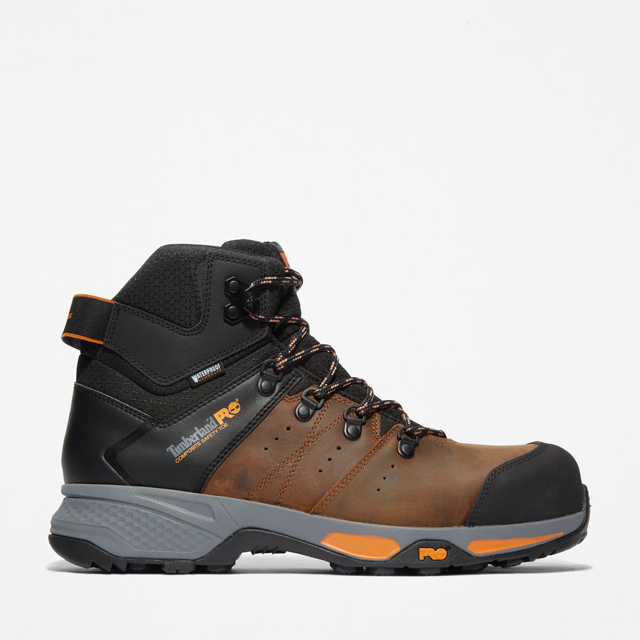 Brown leather and black synthetic Timberland Pro Men's Switchback Work Boot featuring orange accents, reinforced toe, and cushioned sole for comfort and support.