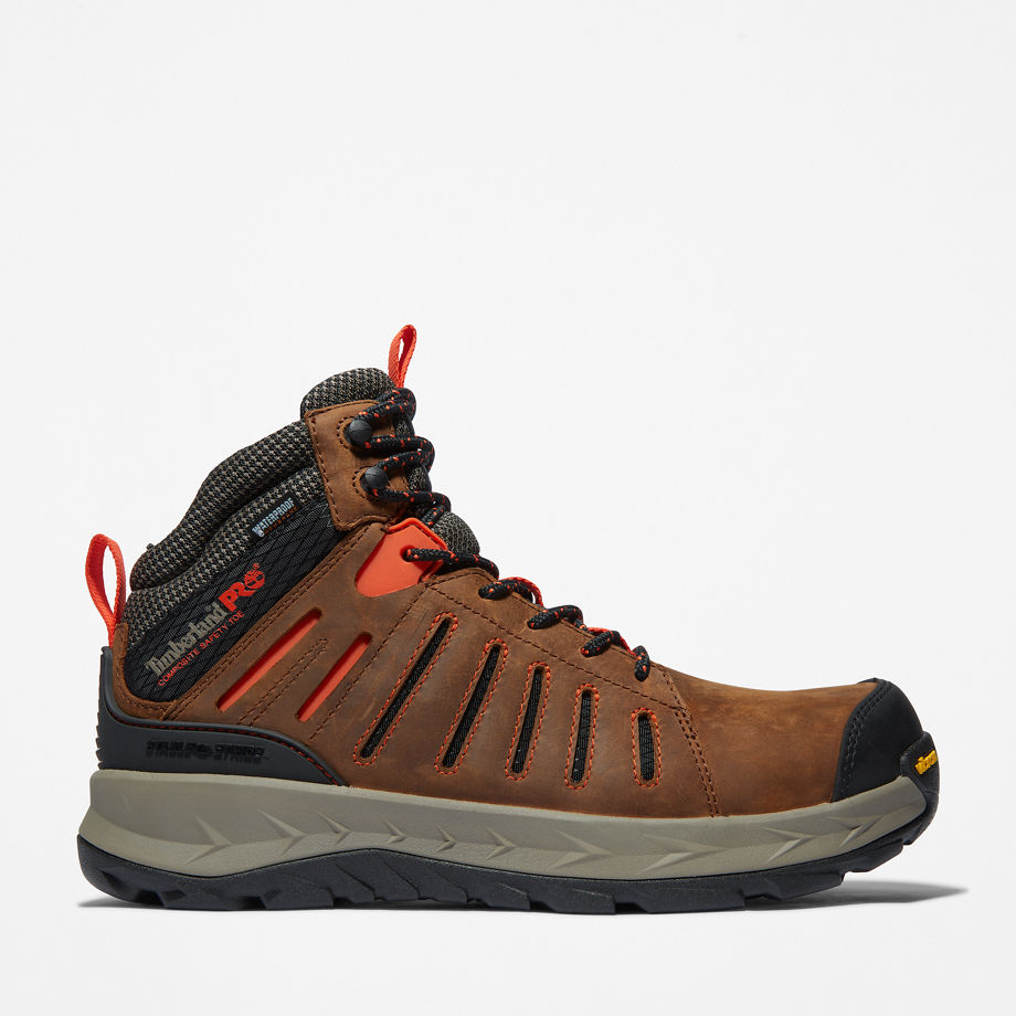 Brown Timberland Pro Men's Trailwind Work Boot featuring a durable leather upper, mesh panels, orange accents, and a rugged sole for traction.