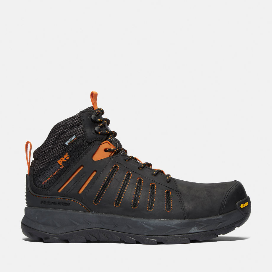 Black Timberland Pro Trailwind waterproof work boots for men, featuring orange accents, mesh panels, and a durable rubber sole, available in UK size 12.