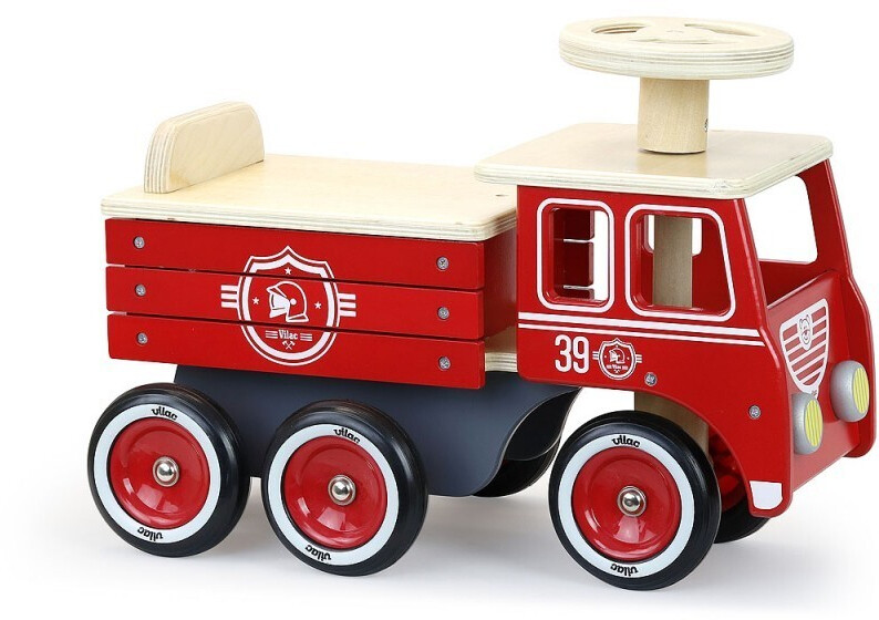 Red wooden firetruck ride-on toy with a natural wood top, four wheels, and a steering wheel, featuring a decorative badge and storage space in the back.