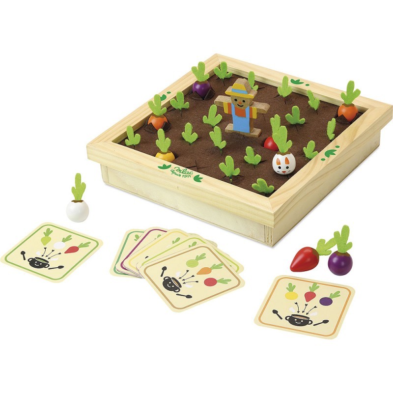 Wooden memory game featuring a garden scene with colorful vegetable pieces, a scarecrow, and illustrated cards depicting various vegetables.