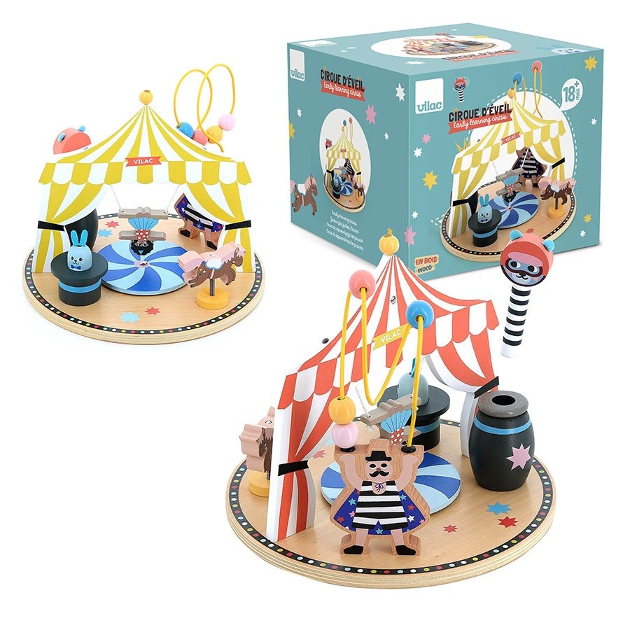 Colorful wooden circus activity toy featuring a striped tent, playful animals, and a clown, set on a circular base with vibrant details and a decorative box.