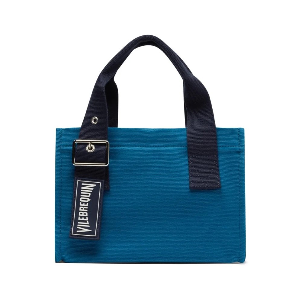 Mini beach bag by Vilebrequin in vibrant blue, featuring sturdy navy handles, a sleek design, and a prominent logo tag, perfect for beach outings.