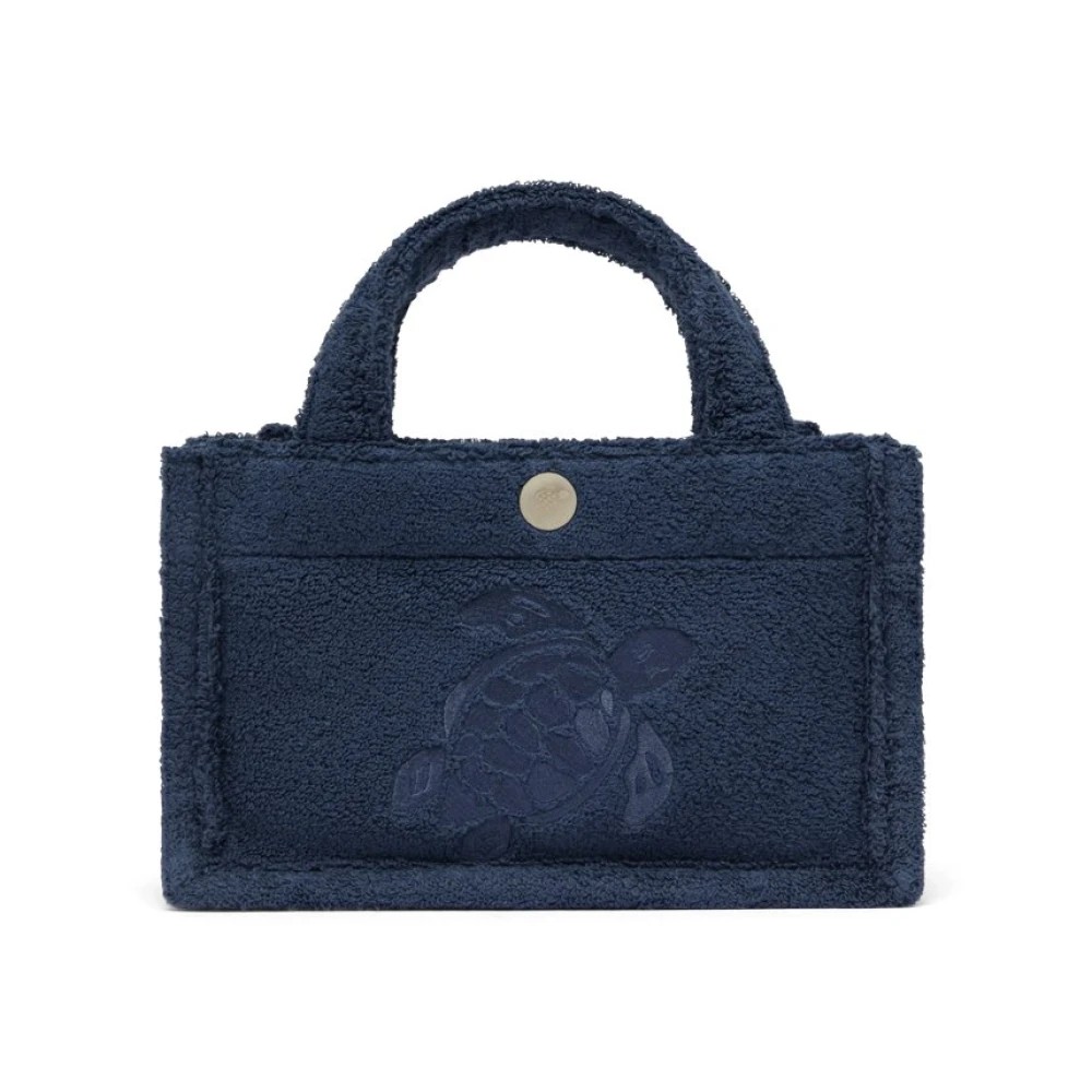 Blue terry cloth mini bag by Vilebrequin featuring a turtle design, two sturdy handles, and a snap closure, ideal for beach outings.