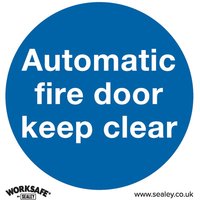 Blue circular sign with white text "Automatic fire door keep clear," Sealey branding at bottom. Pack of 10.