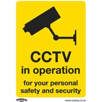 Yellow Sealey self-adhesive vinyl sign with black CCTV camera icon and text "CCTV in operation" in pack of 10.